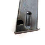 D-Shaped cutout in the magaine for the mag release on the Beretta 92S pistol