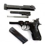 Field stripped Beretta 92S pistol left profile