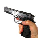 hand holding the Beretta 92S pistol