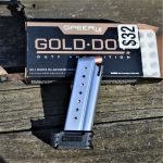 Springfield XD-S pistol magazine with an open box of Speer Gold Dot ammunition