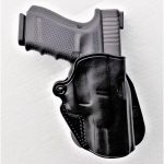 Black Galco paddle holster with Glock pistol