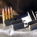 One loaded and several empty en bloc clips