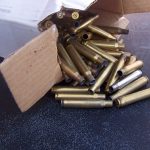 Box of empty rifle cartridge cases